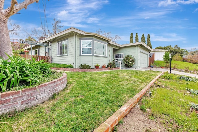 ranch-style house with an attached garage and a front lawn