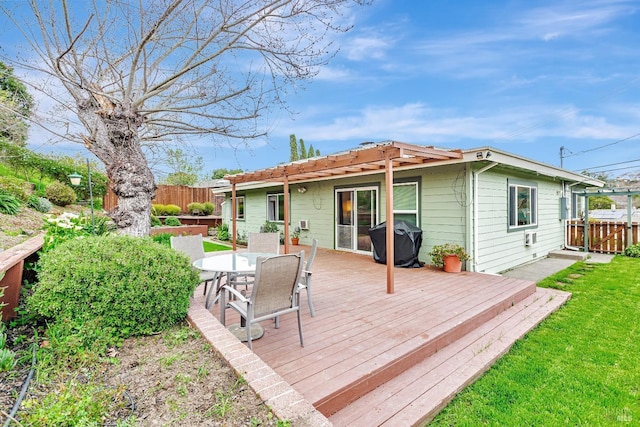 wooden terrace featuring outdoor dining area, area for grilling, fence, and a pergola