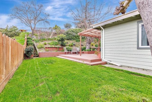 view of yard featuring fence and a pergola