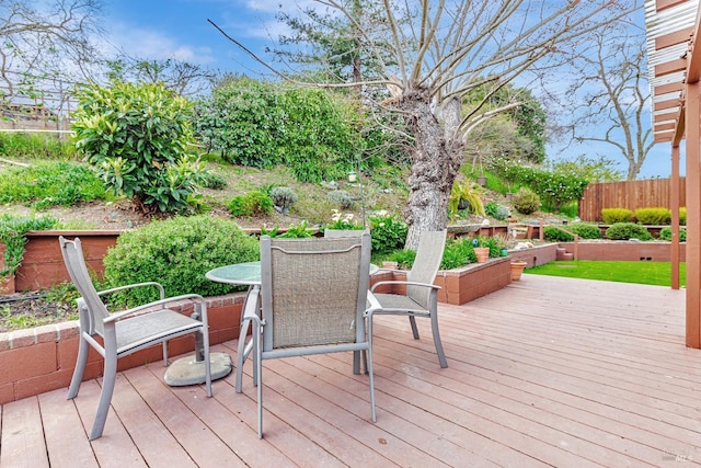 wooden deck featuring outdoor dining area and fence