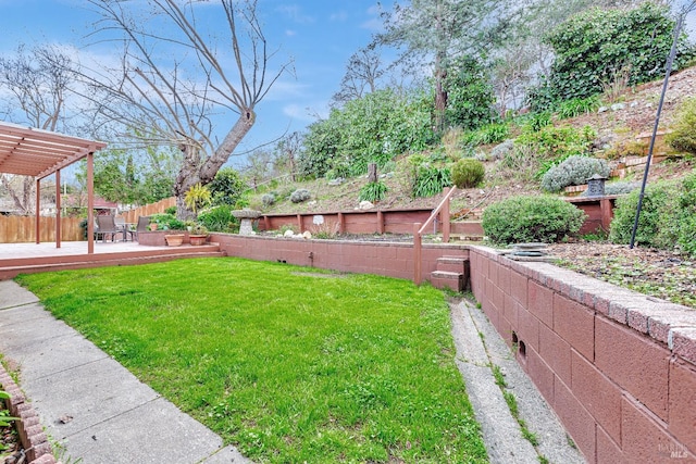 view of yard with a fenced backyard, a deck, and a pergola