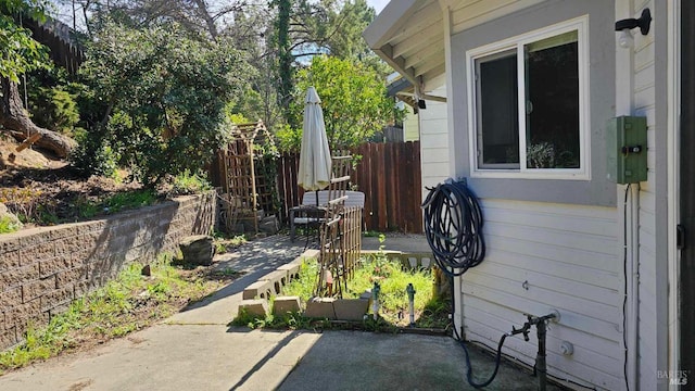 view of patio / terrace featuring fence