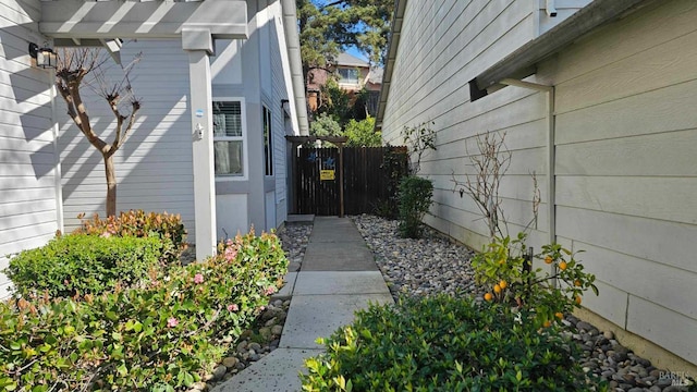 view of exterior entry featuring fence