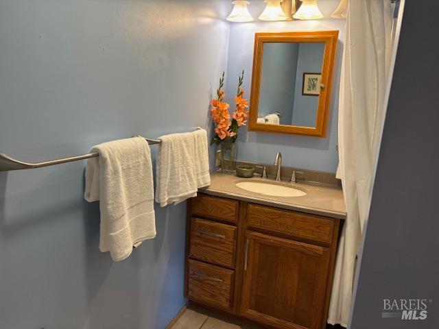 bathroom with tile patterned floors and vanity