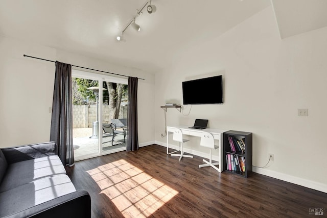 office with lofted ceiling, rail lighting, baseboards, and dark wood finished floors