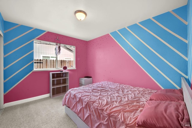 bedroom featuring carpet and baseboards