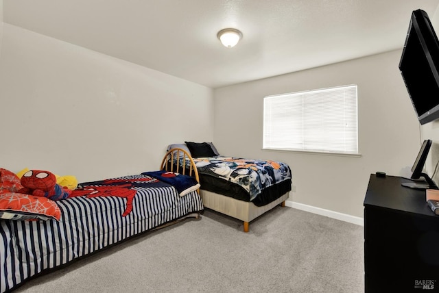 carpeted bedroom with baseboards