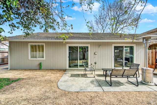 back of house with fence and a patio