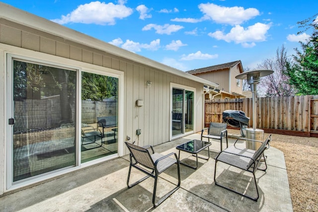 view of patio featuring fence