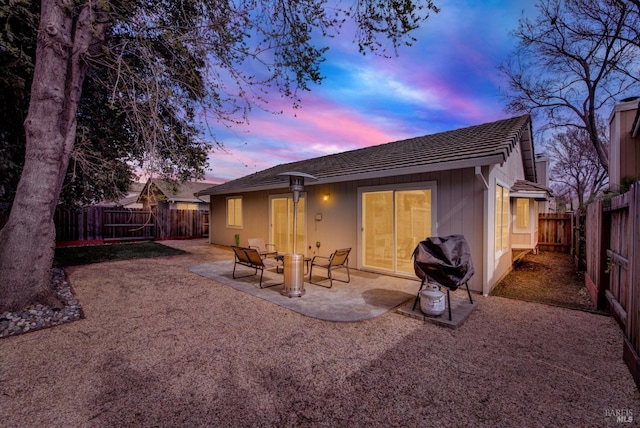 back of property featuring a patio area and a fenced backyard