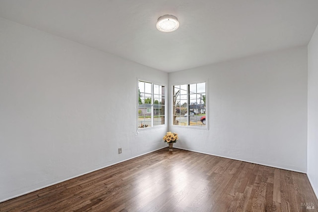 unfurnished room featuring wood finished floors