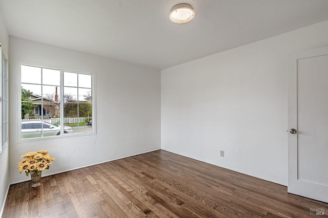 empty room with wood finished floors