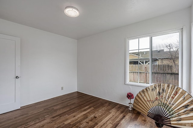 empty room featuring dark wood finished floors