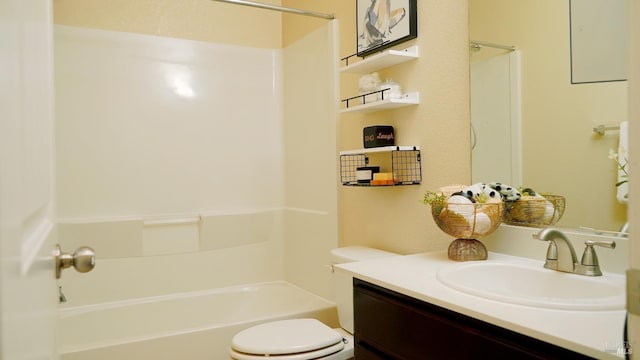 full bath featuring toilet, vanity, and shower / washtub combination
