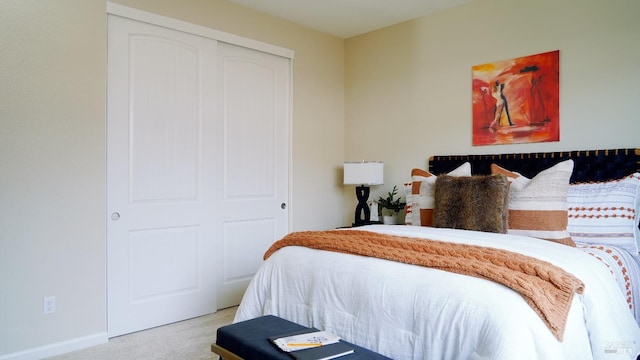 carpeted bedroom with a closet