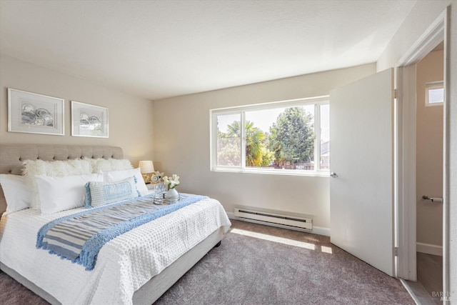 carpeted bedroom featuring baseboards and a baseboard heating unit