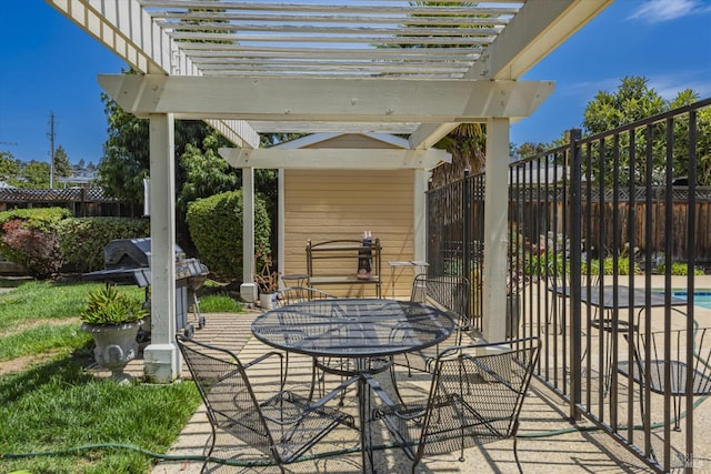 view of patio with outdoor dining area, fence, and a pergola