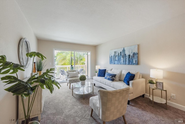 carpeted living area with a textured ceiling and baseboards