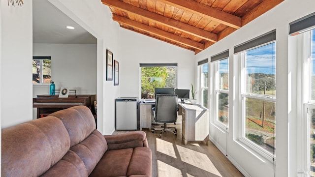 sunroom / solarium featuring vaulted ceiling with beams and wooden ceiling