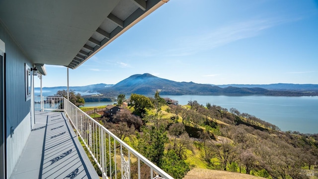 balcony with a water and mountain view