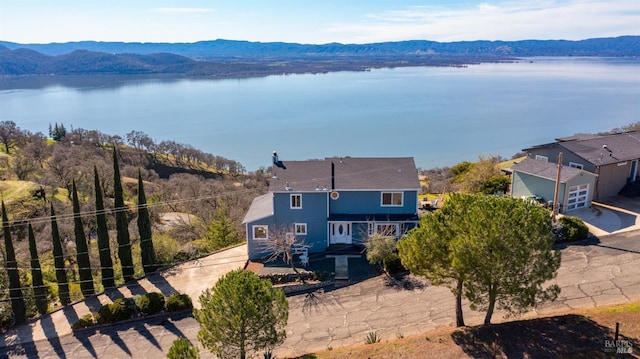 bird's eye view featuring a water and mountain view