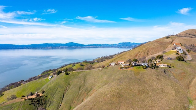 bird's eye view with a water and mountain view