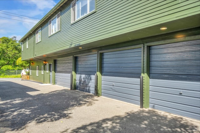 garage with aphalt driveway