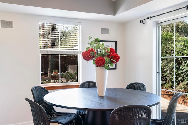 dining room featuring visible vents