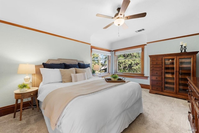 bedroom featuring light carpet, ceiling fan, visible vents, and baseboards