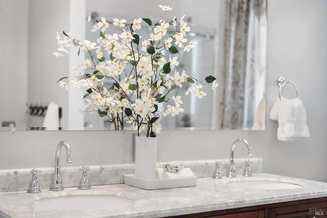 bathroom with double vanity and a sink