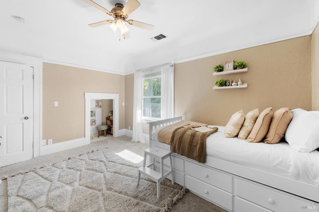 bedroom with carpet floors, baseboards, visible vents, and a ceiling fan