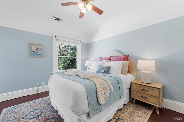 bedroom with a ceiling fan, visible vents, baseboards, ornamental molding, and dark wood-style floors