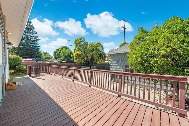 deck with a fenced backyard