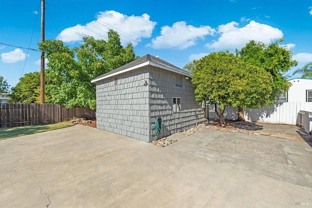 view of outdoor structure featuring a fenced backyard