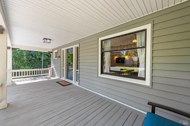 wooden terrace with a porch