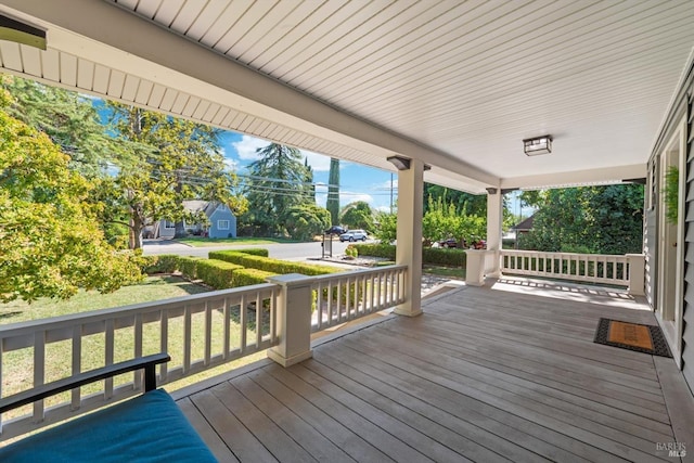 wooden terrace with a porch