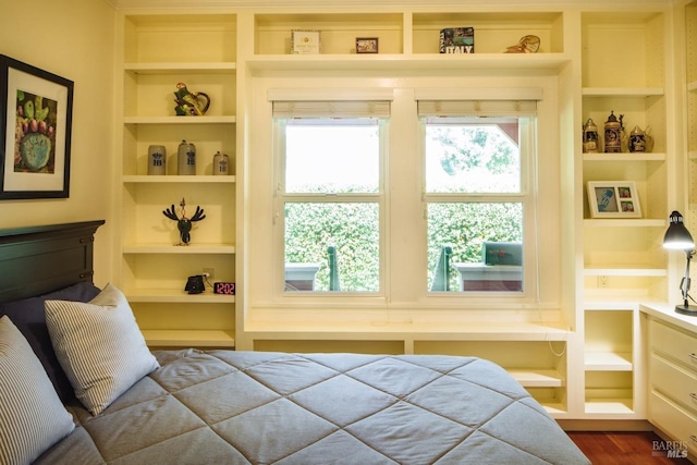 bedroom with wood finished floors