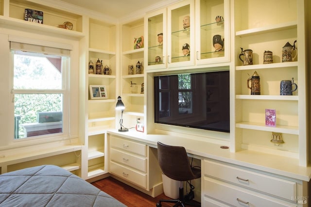 office area featuring built in desk and dark wood finished floors