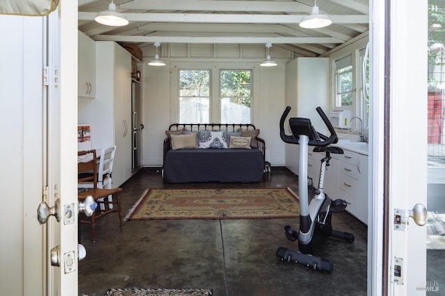 exercise room with lofted ceiling