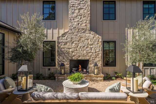 view of patio / terrace with an outdoor living space with a fireplace