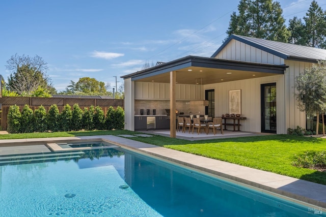 rear view of property featuring a fenced in pool, a yard, board and batten siding, a patio area, and fence