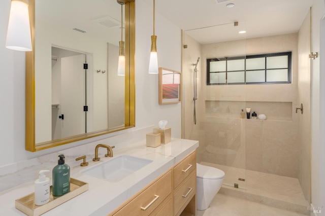 bathroom featuring toilet, visible vents, a walk in shower, and vanity