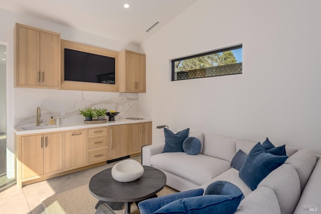 living area featuring recessed lighting and vaulted ceiling