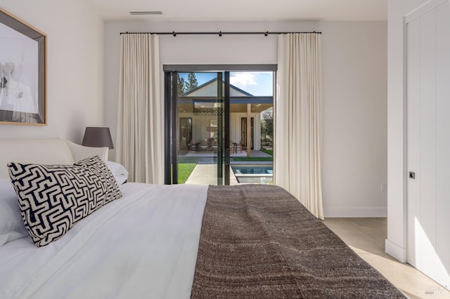 bedroom with baseboards, visible vents, and access to exterior