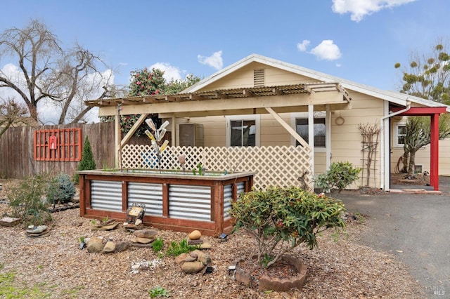 view of front of home with fence