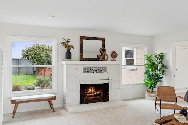 carpeted living room with a fireplace