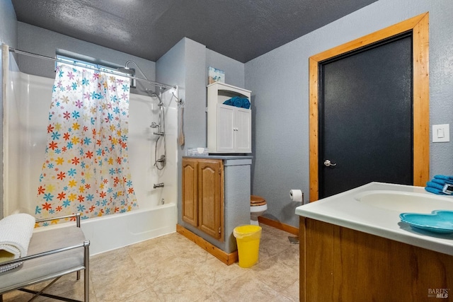 full bathroom with shower / bath combo, baseboards, toilet, a textured ceiling, and vanity