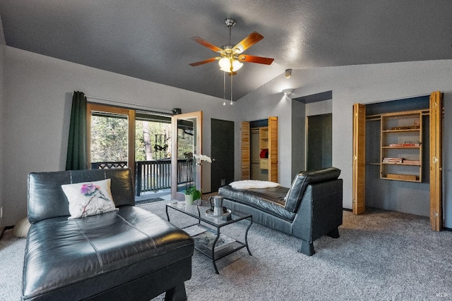 carpeted living room with lofted ceiling and a ceiling fan