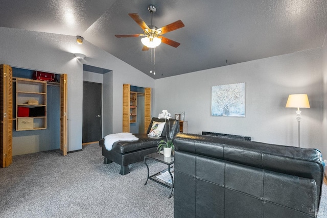 living room featuring carpet floors, lofted ceiling, and ceiling fan