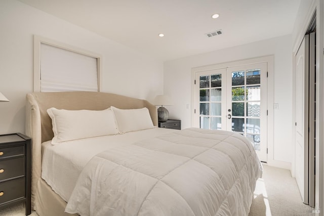 bedroom with french doors, recessed lighting, light colored carpet, visible vents, and access to outside